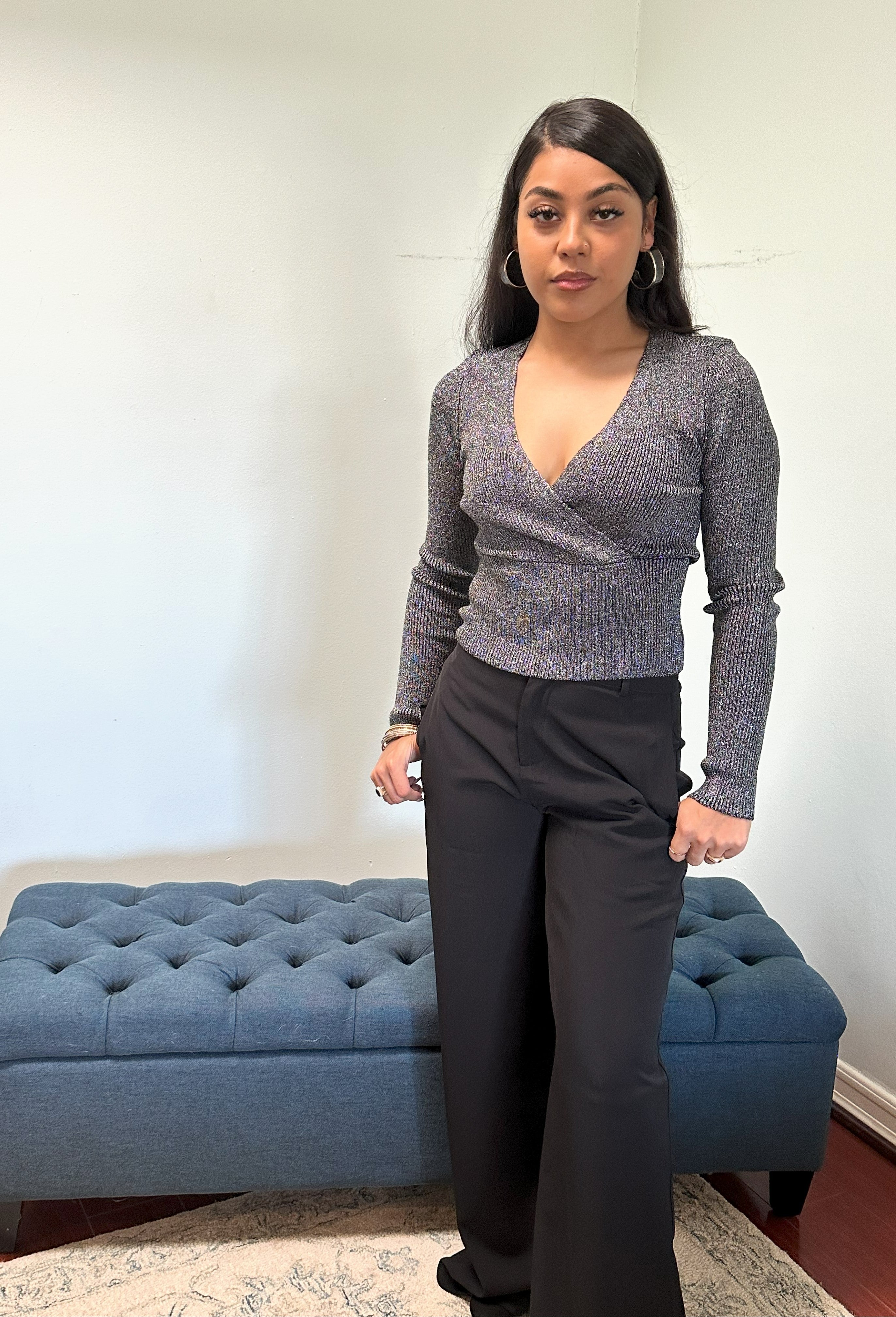Shimmering metallic ribbed sweater with a fitted silhouette, long sleeves, cross-over V-neck, and a soft stretch fabric