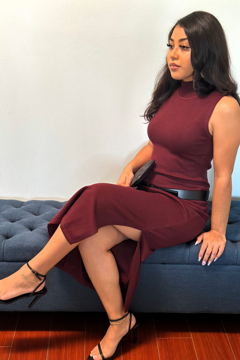 Burgundy mock neck sleeveless sweater dress featuring a side slit for the ultimate chic and sexy look