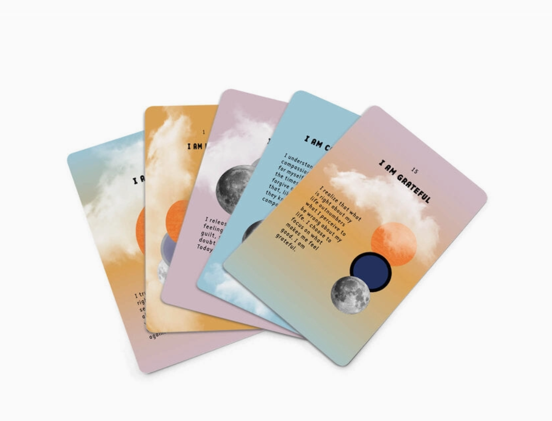 Set of five affirmation cards with celestial designs and text 